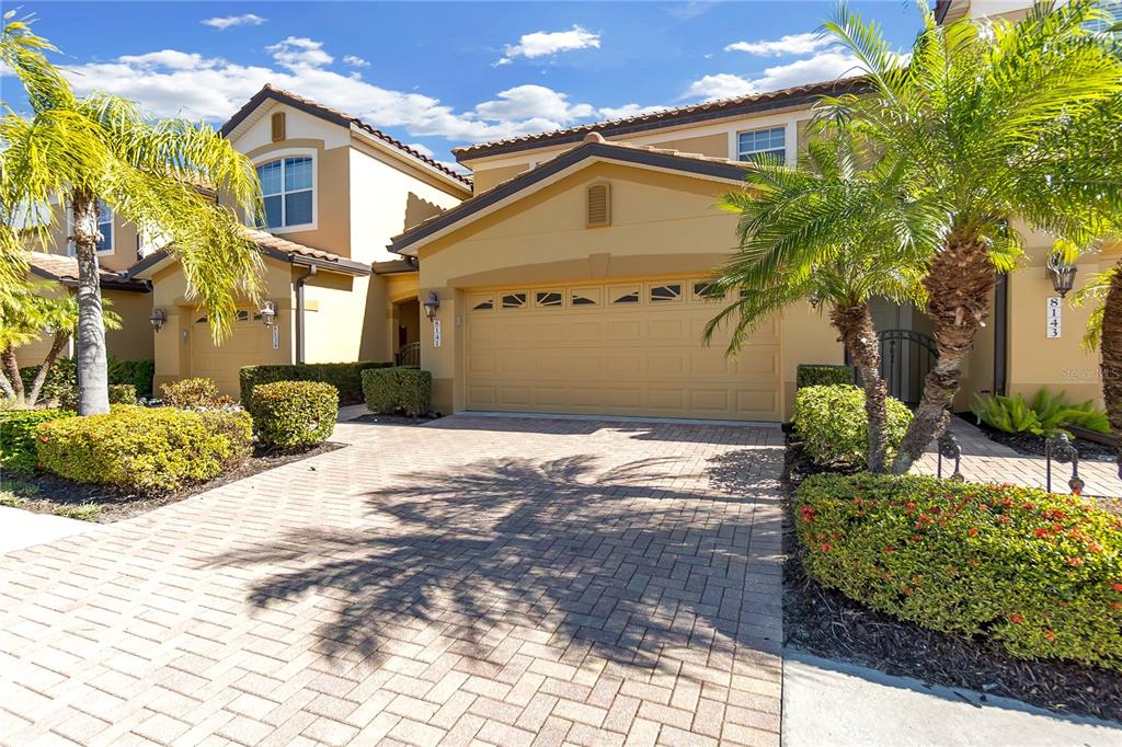 8141 Miramar Way, Unit 8141 Lakewood Ranch, FL 34202 - Photo 4 of 26 a view of a house with a yard