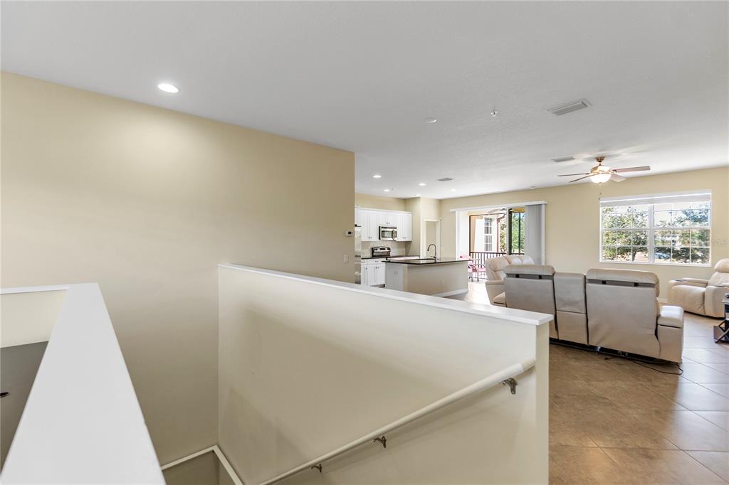 8141 Miramar Way, Unit 8141 Lakewood Ranch, FL 34202 - Photo 5 of 26 a living room with furniture and appliances