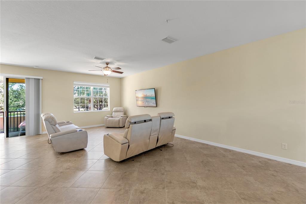 8141 Miramar Way, Unit 8141 Lakewood Ranch, FL 34202 - Photo 8 of 26 a living room with furniture and a window