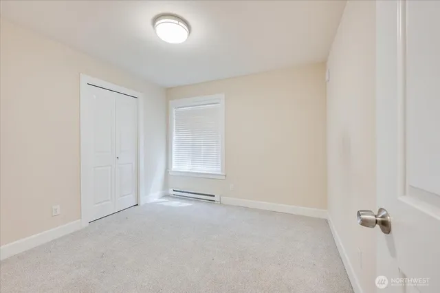 an empty room with a empty space and a window