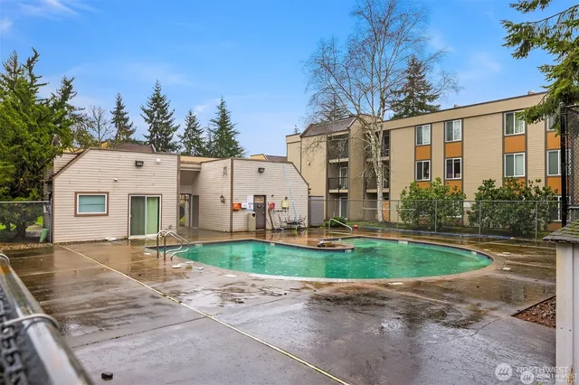 a view of a white house with a yard