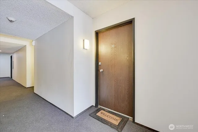 a view of a hallway with closet