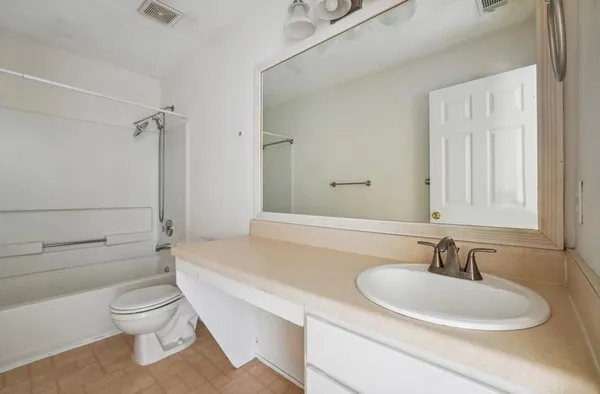 a bathroom with a sink a toilet and a bathtub
