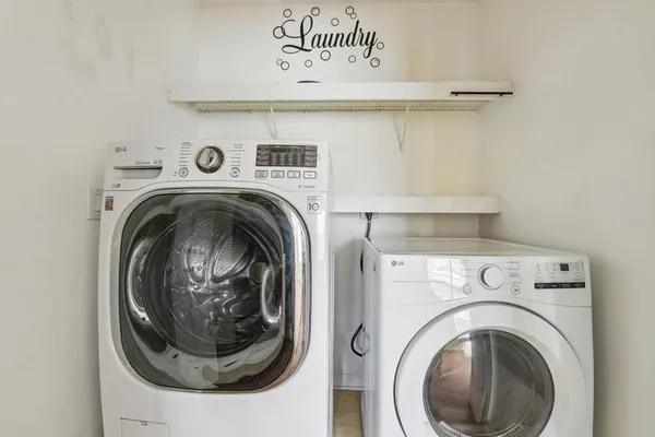 a utility room with dryer and washer