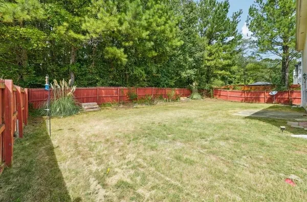 a view of yard with swimming pool