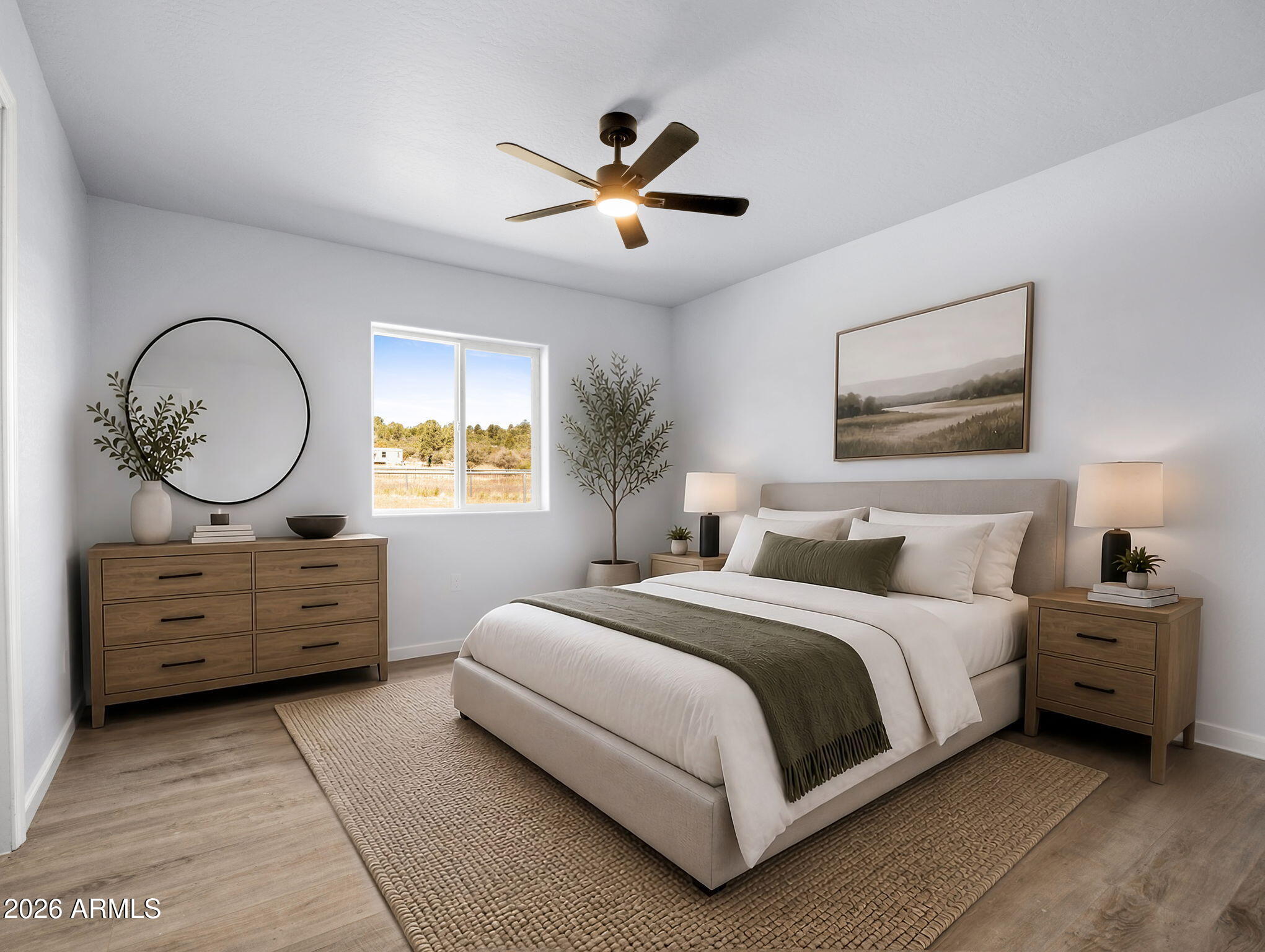 18278 Frontier Road Peeples Valley, AZ 86332 - Photo 19 of 31 a bed room with a bed and a chandelier