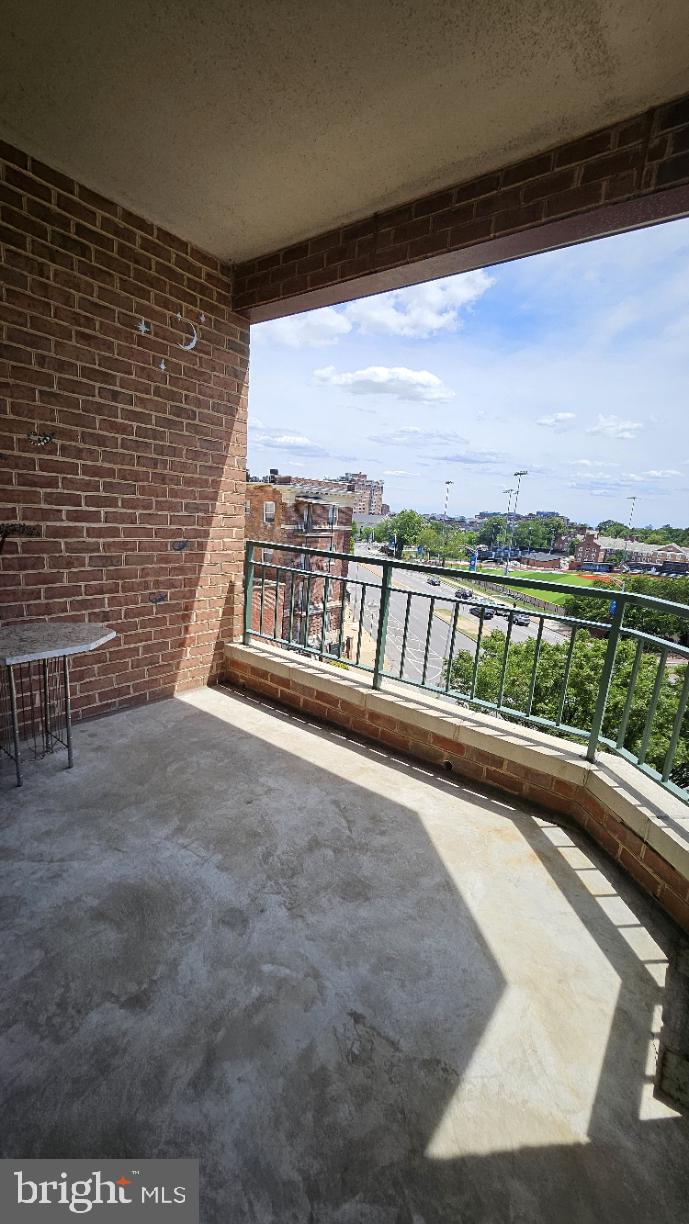3801 Canterbury Road, Unit 409 Baltimore, MD 21218 - Photo 20 of 31 Sunny balcony with urban views.