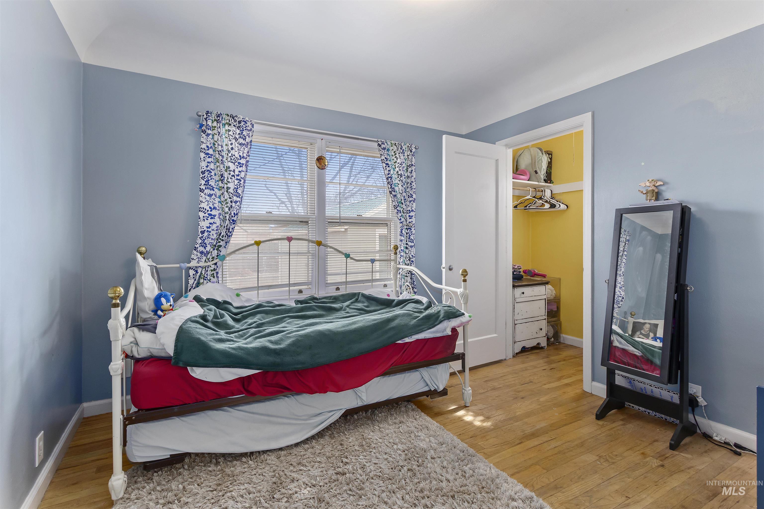 184 Taylor Street Twin Falls, ID 83301 - Photo 11 of 23 Bedroom with light wood-type flooring and baseboards