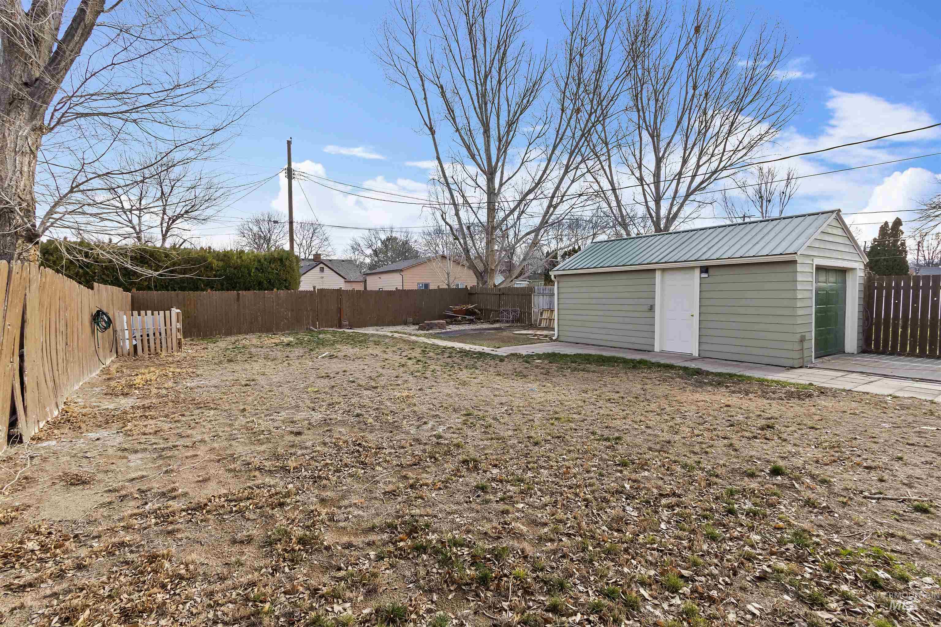 184 Taylor Street Twin Falls, ID 83301 - Photo 23 of 23 Fenced backyard with an outdoor structure