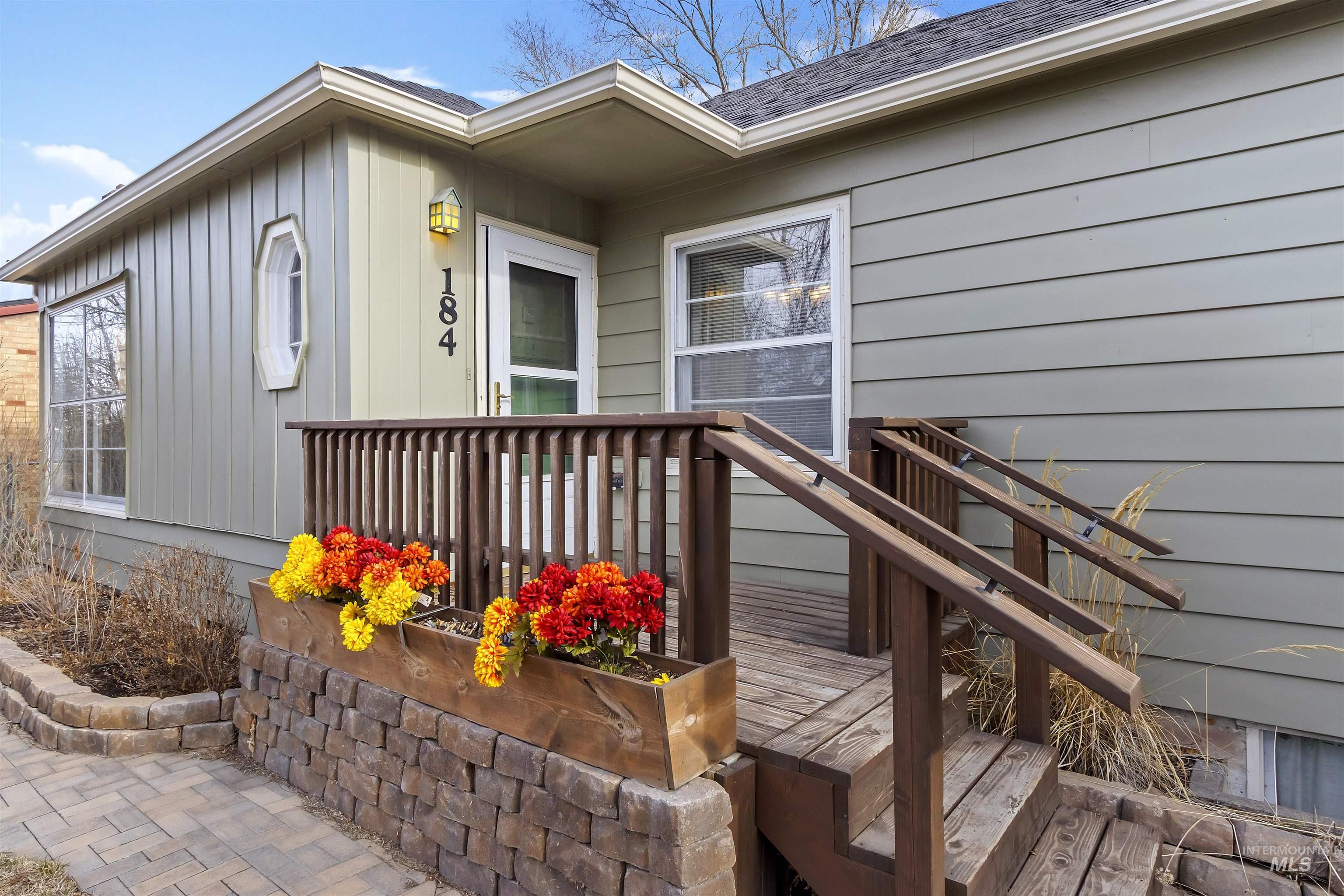 184 Taylor Street Twin Falls, ID 83301 - Photo 4 of 23 Property entrance with roof with shingles and a deck