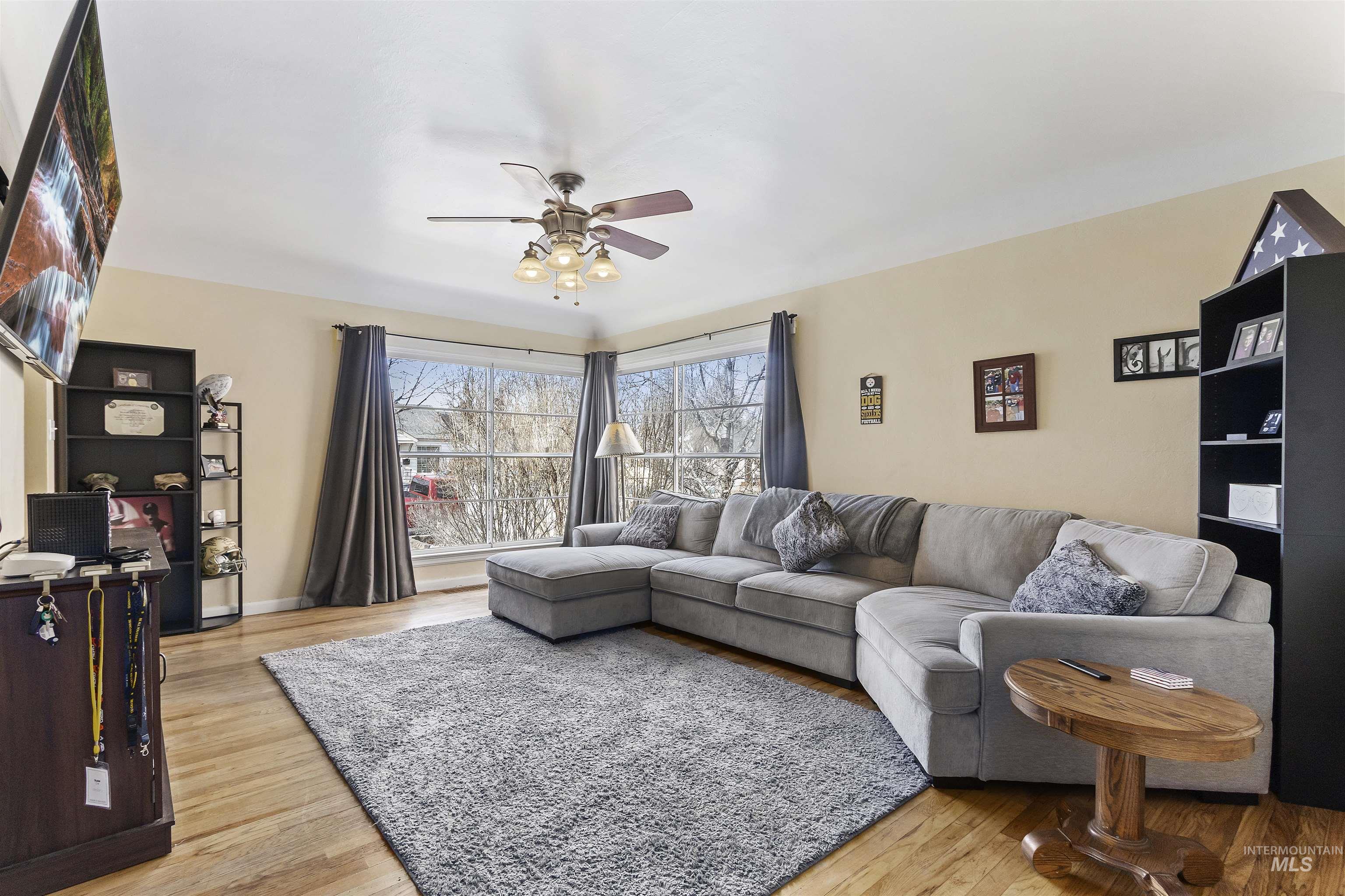 184 Taylor Street Twin Falls, ID 83301 - Photo 5 of 23 Living room featuring light wood-type flooring and a ceiling fan
