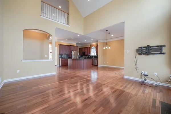 a view of a living room a room with wooden floor
