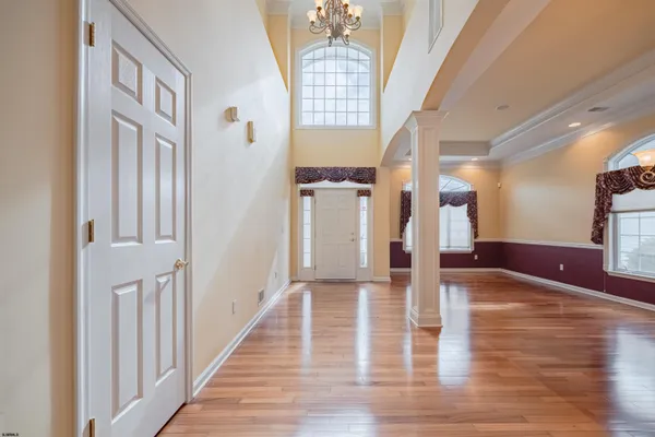 a view of an entryway with wooden floor