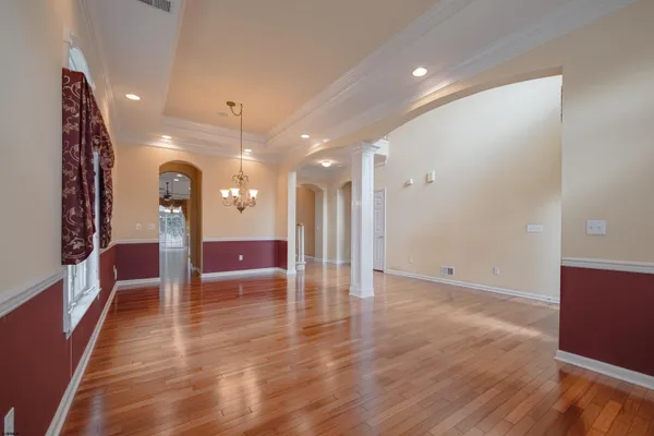 a kitchen with stainless steel appliances granite countertop a refrigerator a stove and a sink