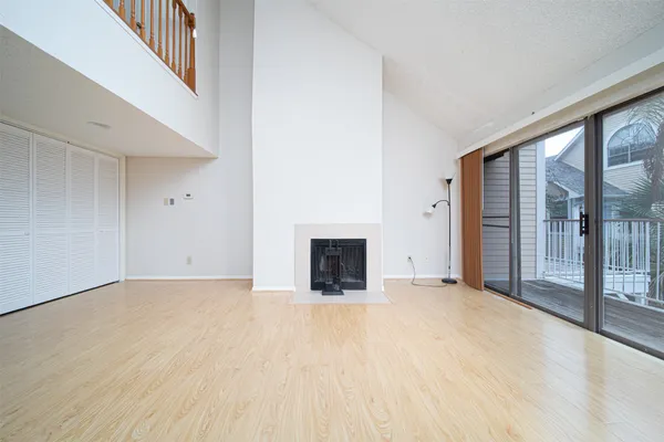 a view of an empty room with glass door