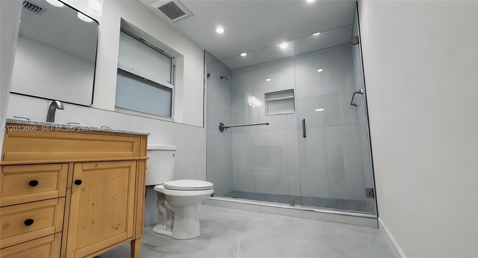8440 Southwest 107th Street, Unit GH Miami, FL 33156 - Photo 12 of 22 a bathroom with a toilet sink and shower