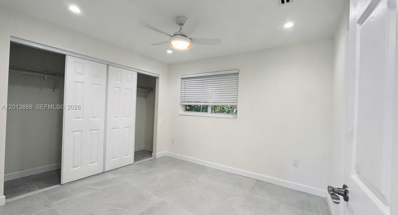 8440 Southwest 107th Street, Unit GH Miami, FL 33156 - Photo 15 of 22 an empty room with windows