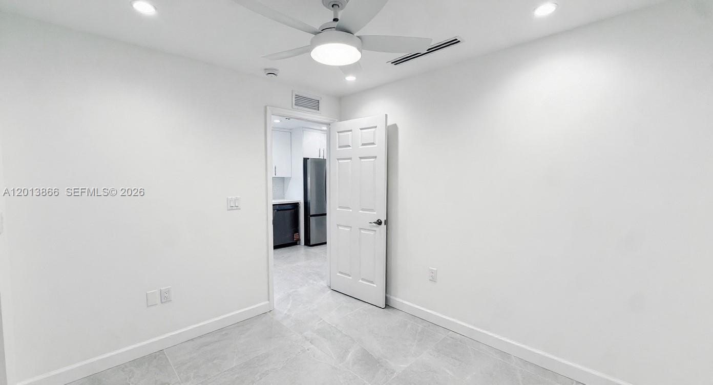 8440 Southwest 107th Street, Unit GH Miami, FL 33156 - Photo 16 of 22 an empty room with a bathroom