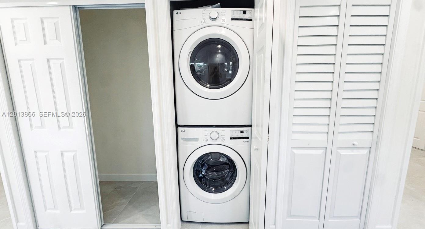 8440 Southwest 107th Street, Unit GH Miami, FL 33156 - Photo 8 of 22 a utility room with dryer and washer