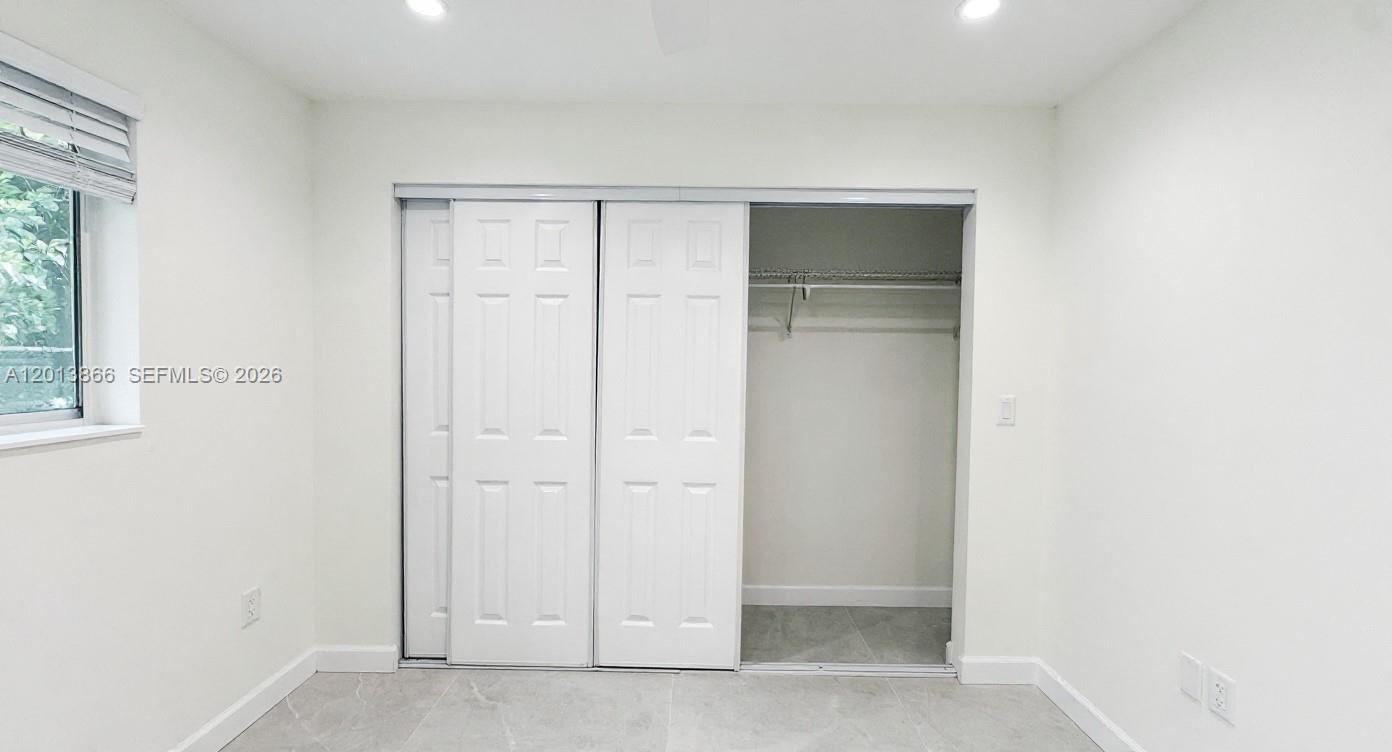 8440 Southwest 107th Street, Unit GH Miami, FL 33156 - Photo 10 of 22 a view of an empty room