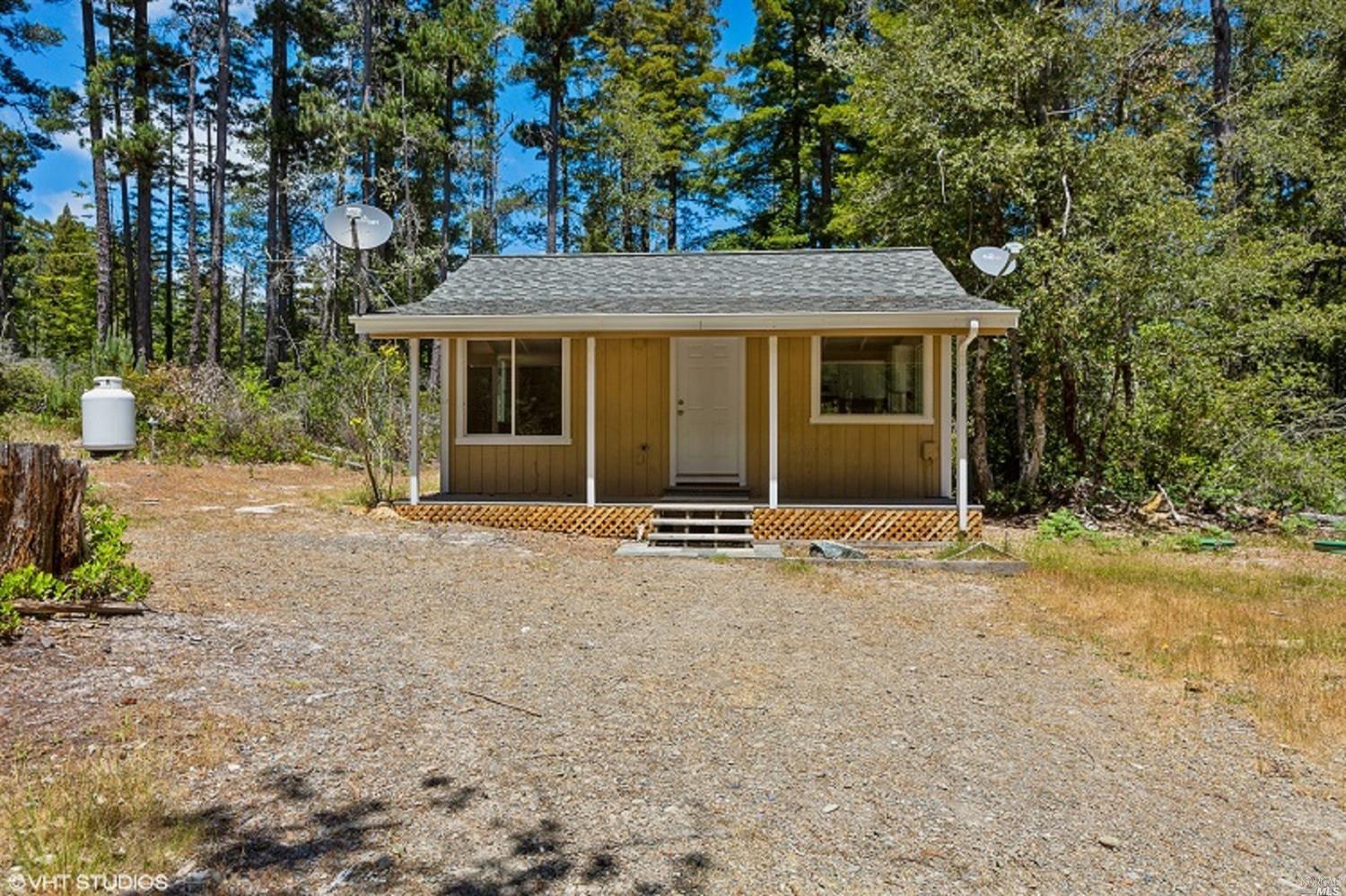 front view of a house with a yard