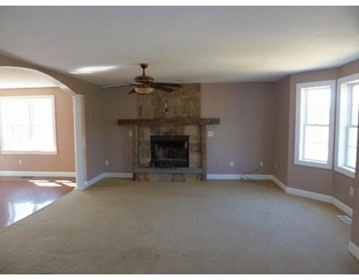 20 Ayers Road Monson, MA 01057 - Photo 3 of 6 an empty room with windows and fireplace