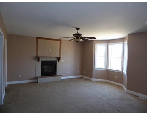 20 Ayers Road Monson, MA 01057 - Photo 5 of 6 an empty room with windows and fireplace