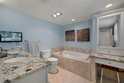 a bathroom with a sink a toilet and bathtub