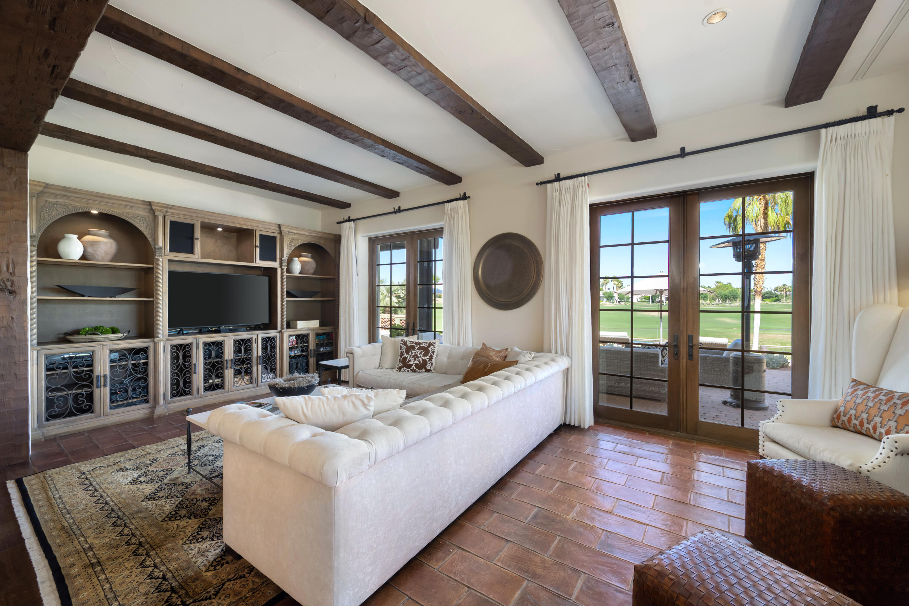 53760 Via Palacio La Quinta, CA 92253 - Photo 12 of 55 a living room with furniture and a floor to ceiling window