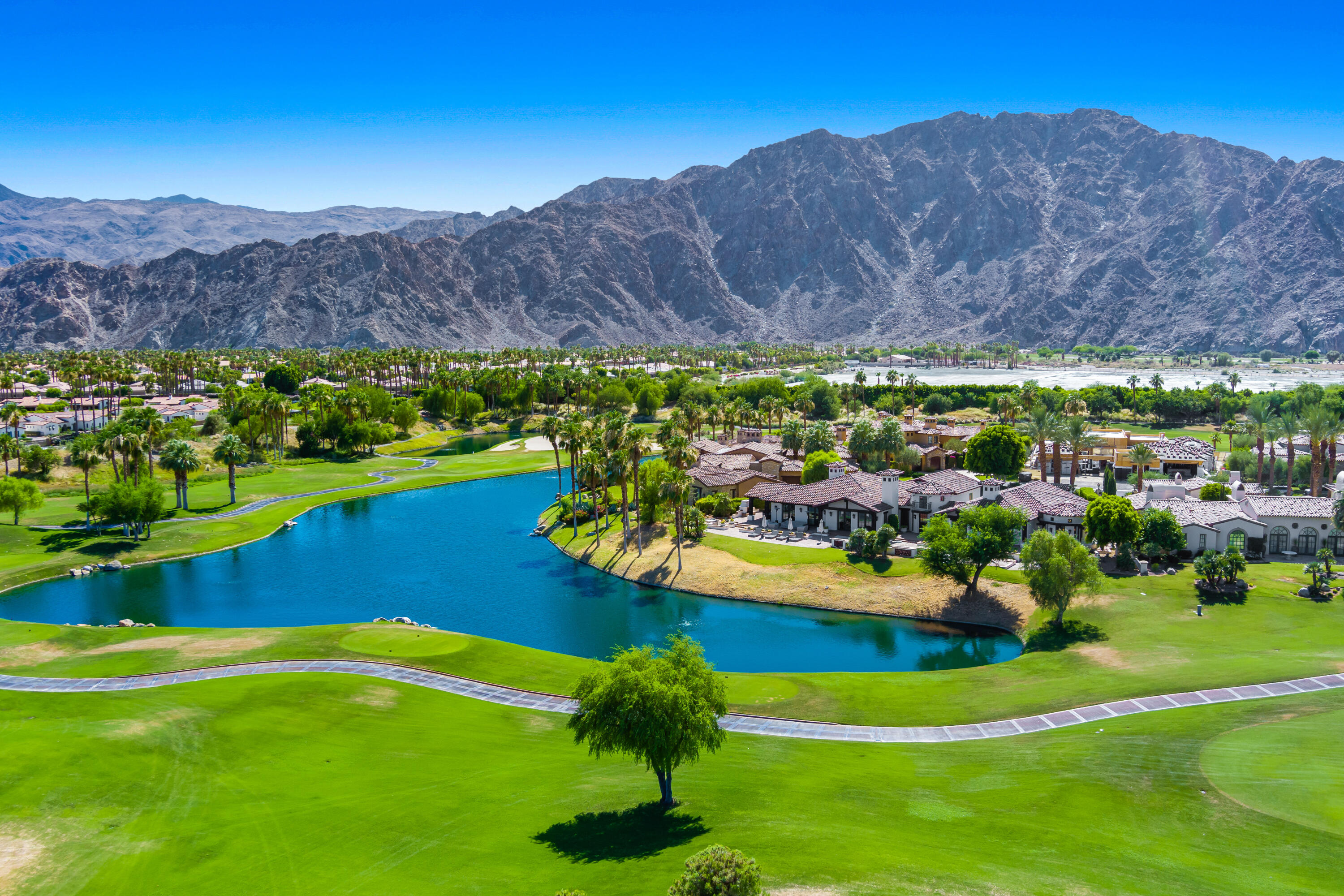 53760 Via Palacio La Quinta, CA 92253 - Photo 2 of 55 a view of a lake with a mountain in the background