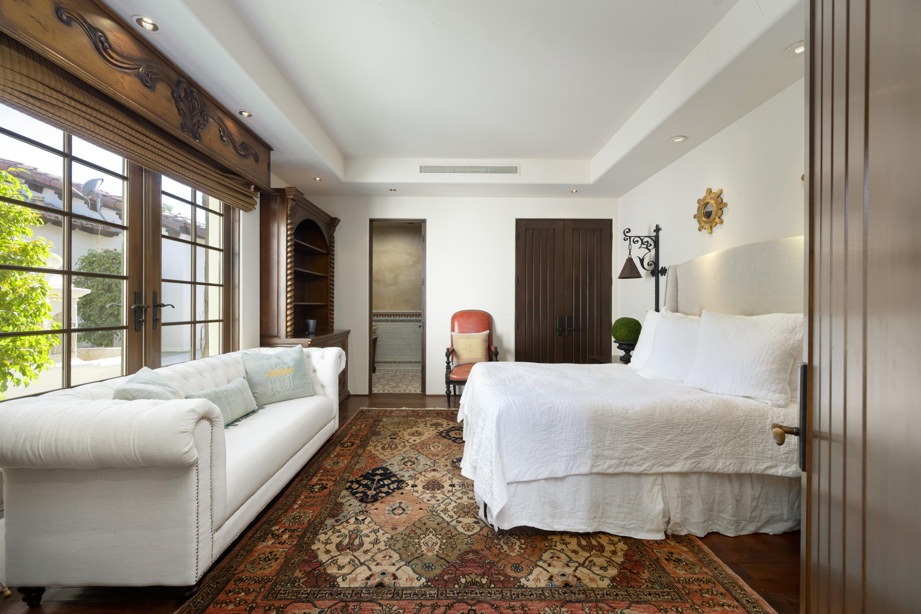 53760 Via Palacio La Quinta, CA 92253 - Photo 26 of 55 a bedroom with a large bed and a window