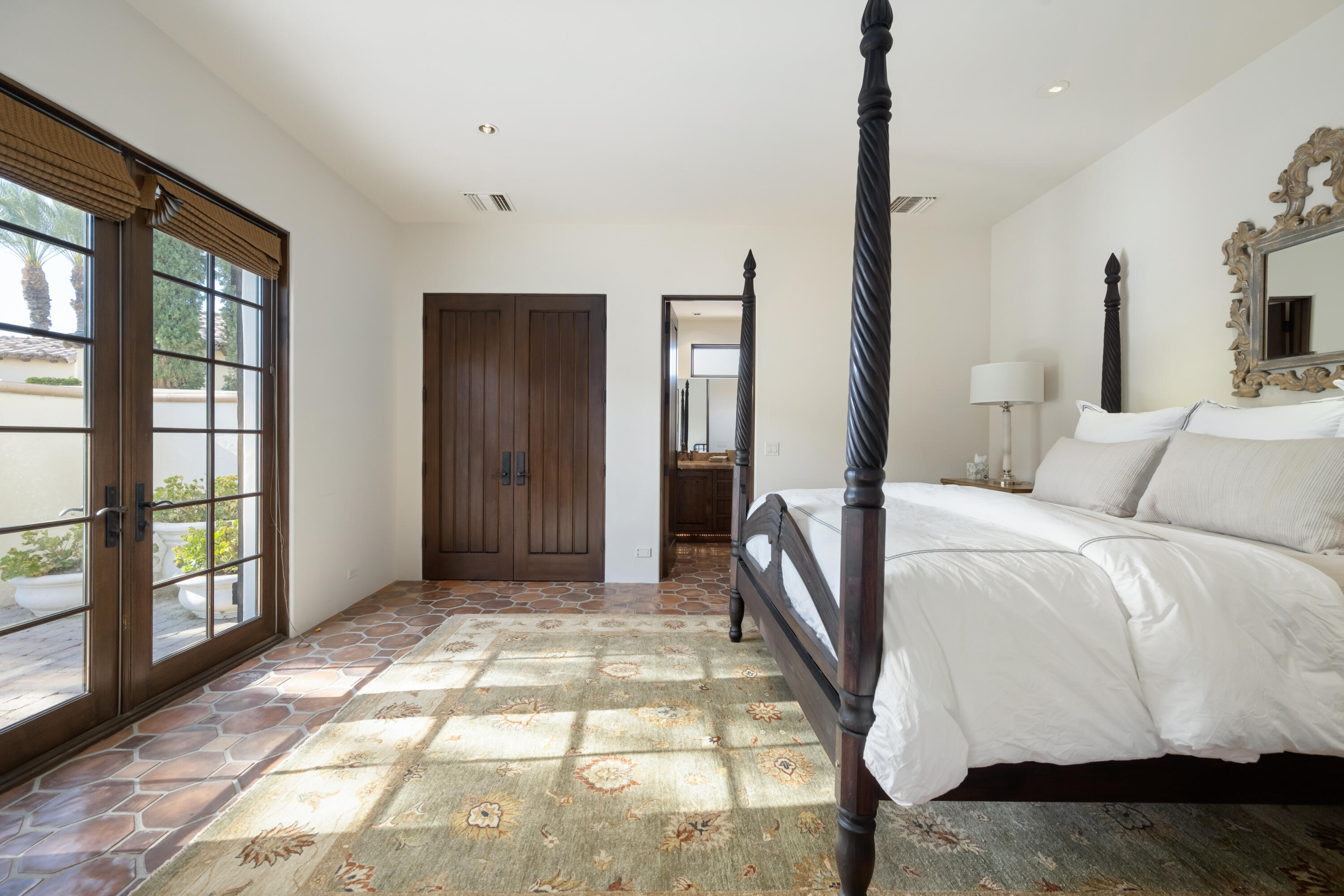 53760 Via Palacio La Quinta, CA 92253 - Photo 33 of 55 a bedroom with a large bed and a window