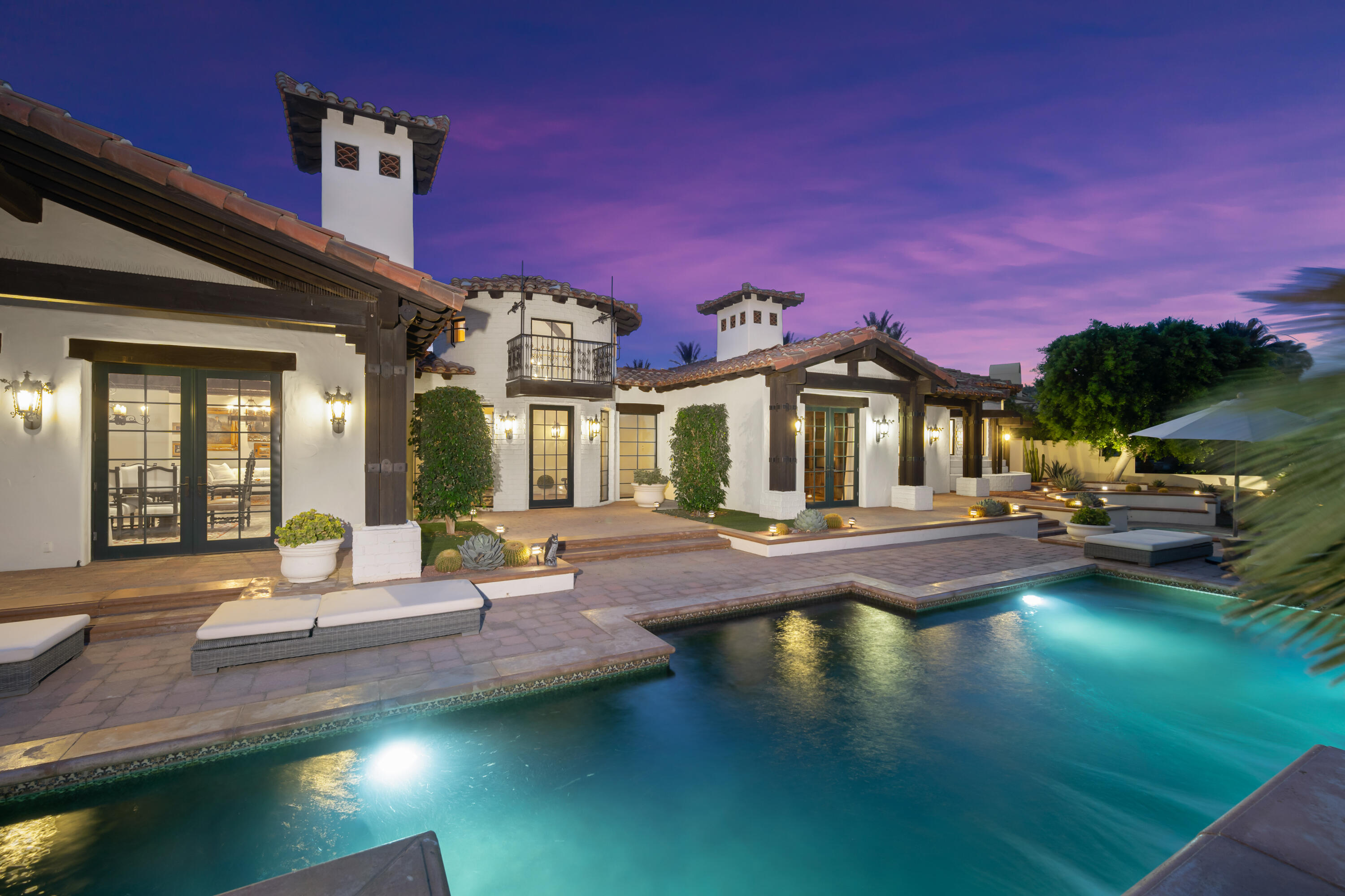 53760 Via Palacio La Quinta, CA 92253 - Photo 50 of 55 a front view of a house with swimming pool yard and outdoor seating
