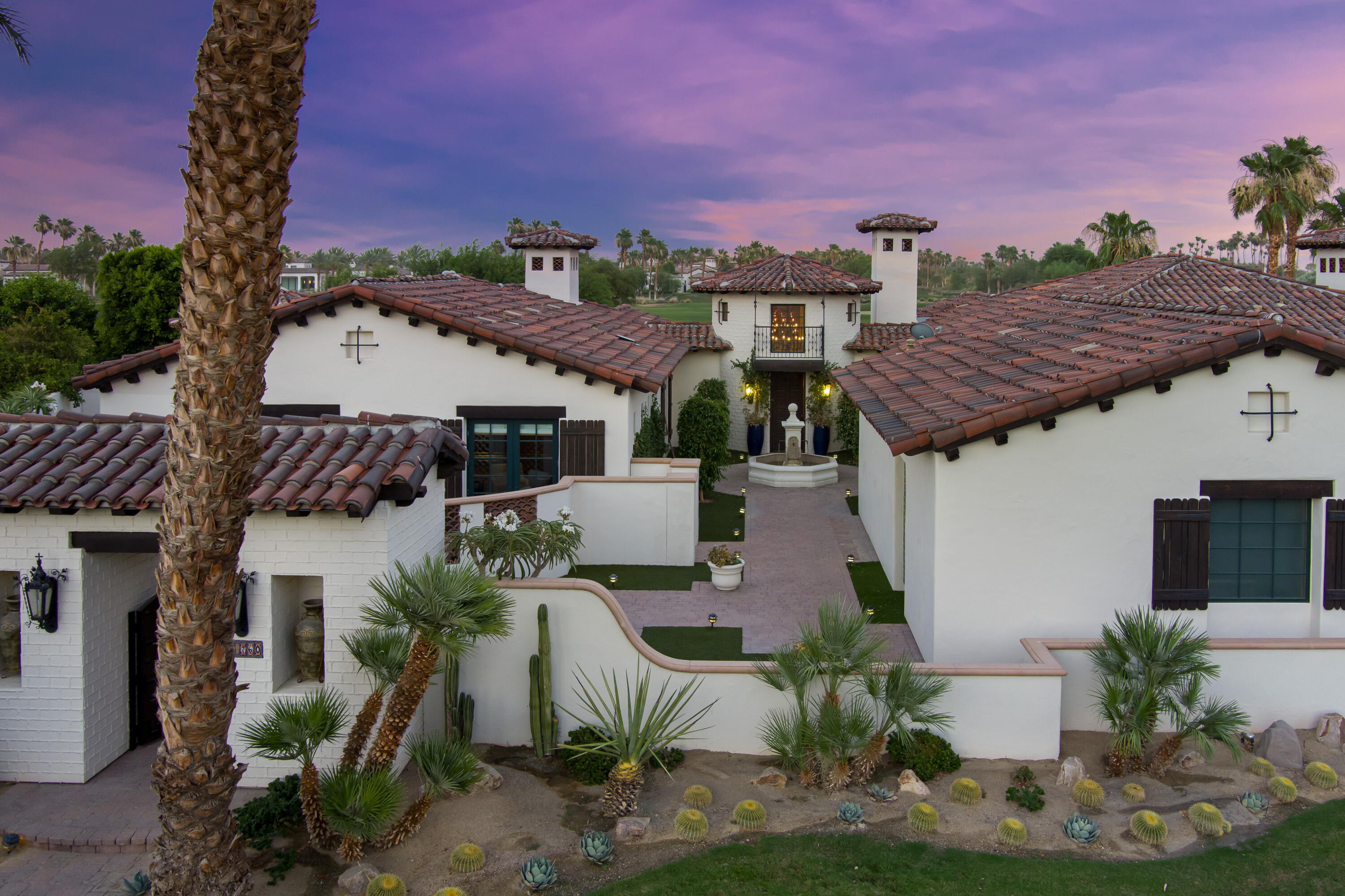 53760 Via Palacio La Quinta, CA 92253 - Photo 5 of 55 a front view of a house with a yard and mountain view