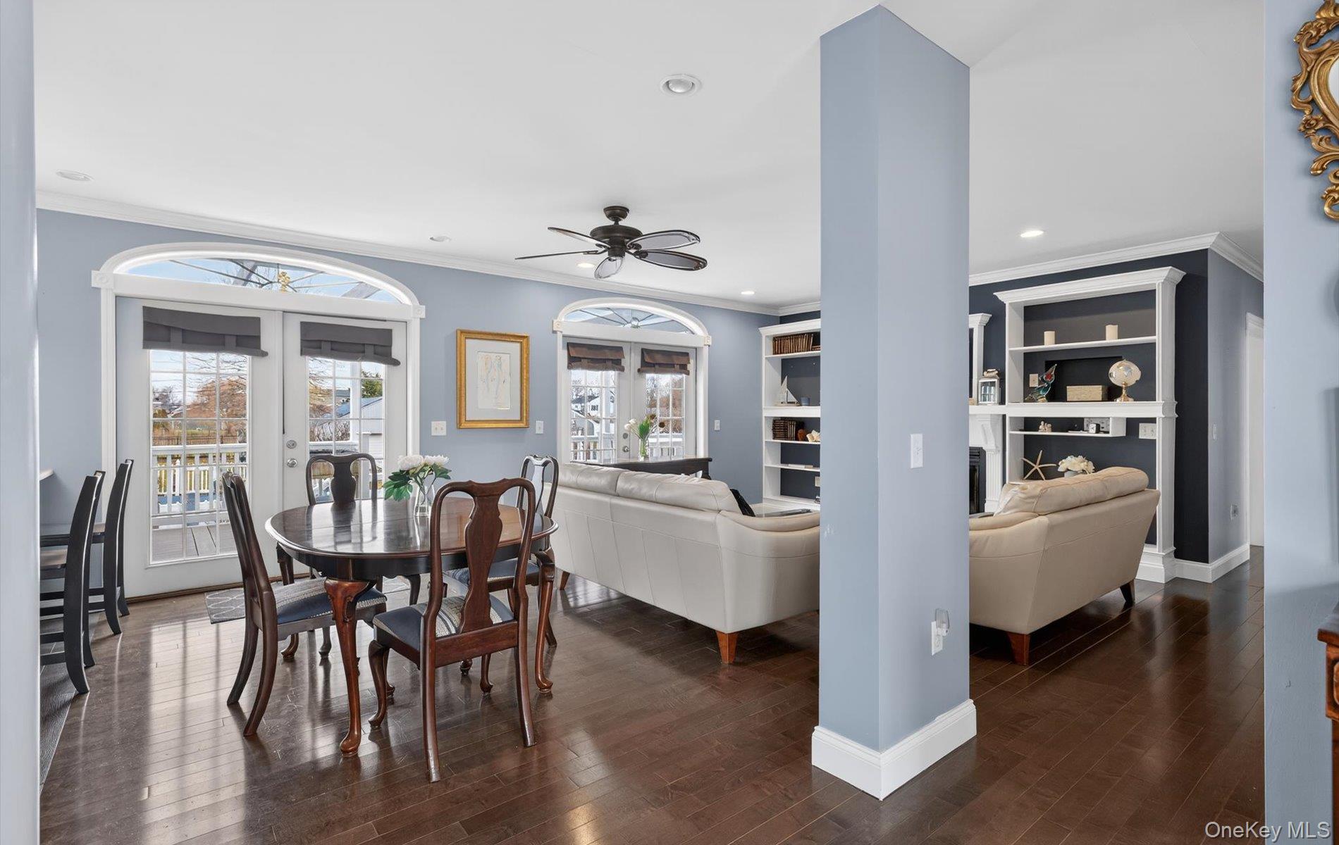 108 Awixa Avenue Bay Shore, NY 11706 - Photo 10 of 47 Dining room featuring crown molding, dark wood finished floors, ceiling fan, recessed lighting, and french doors