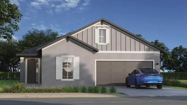 a front view of house with garage and yard