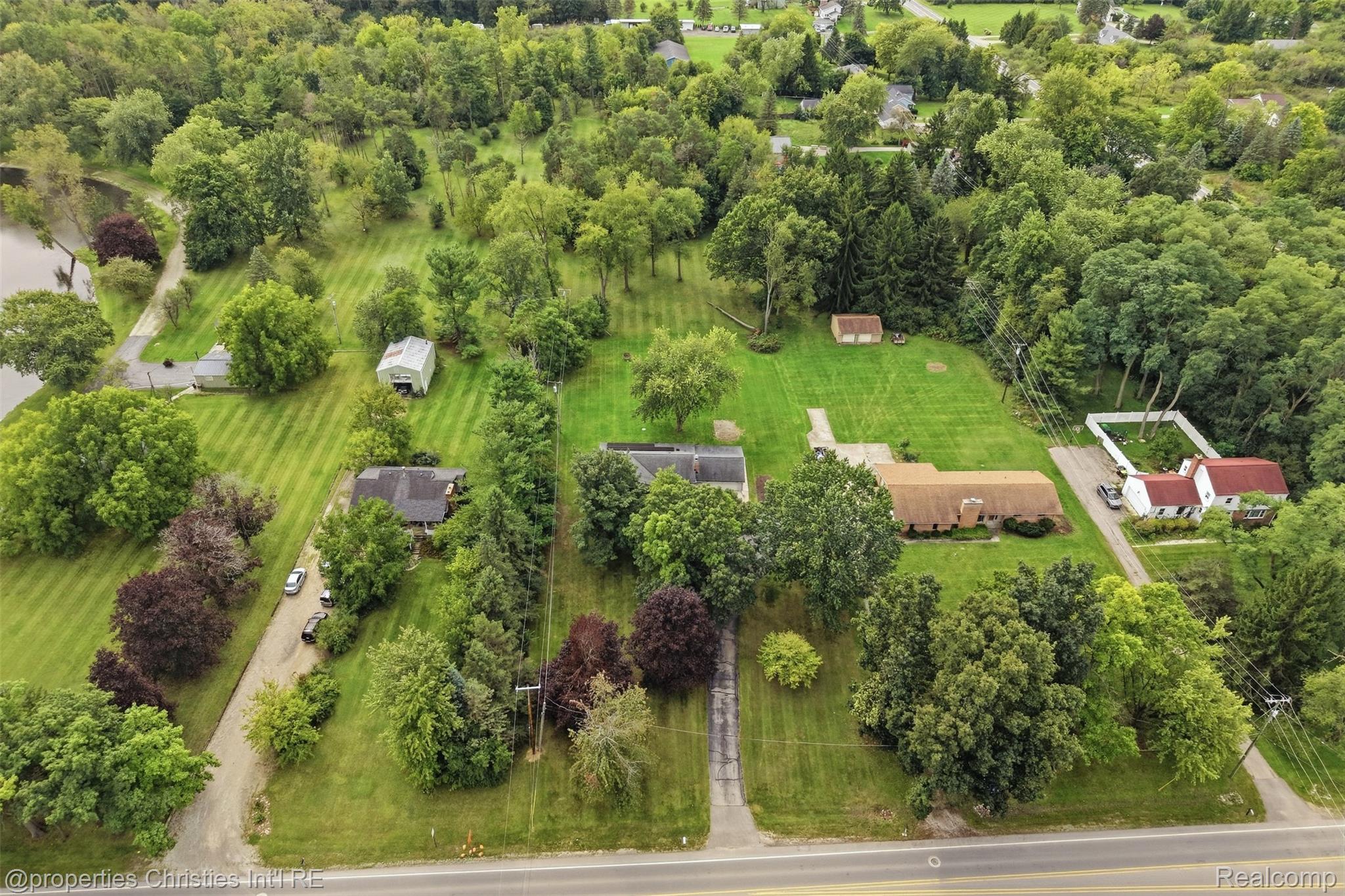 4030 Textile Road Ypsilanti, MI 48197 - Photo 48 of 58 Expansive property featuring multiple structures, mature trees, and extensive green space