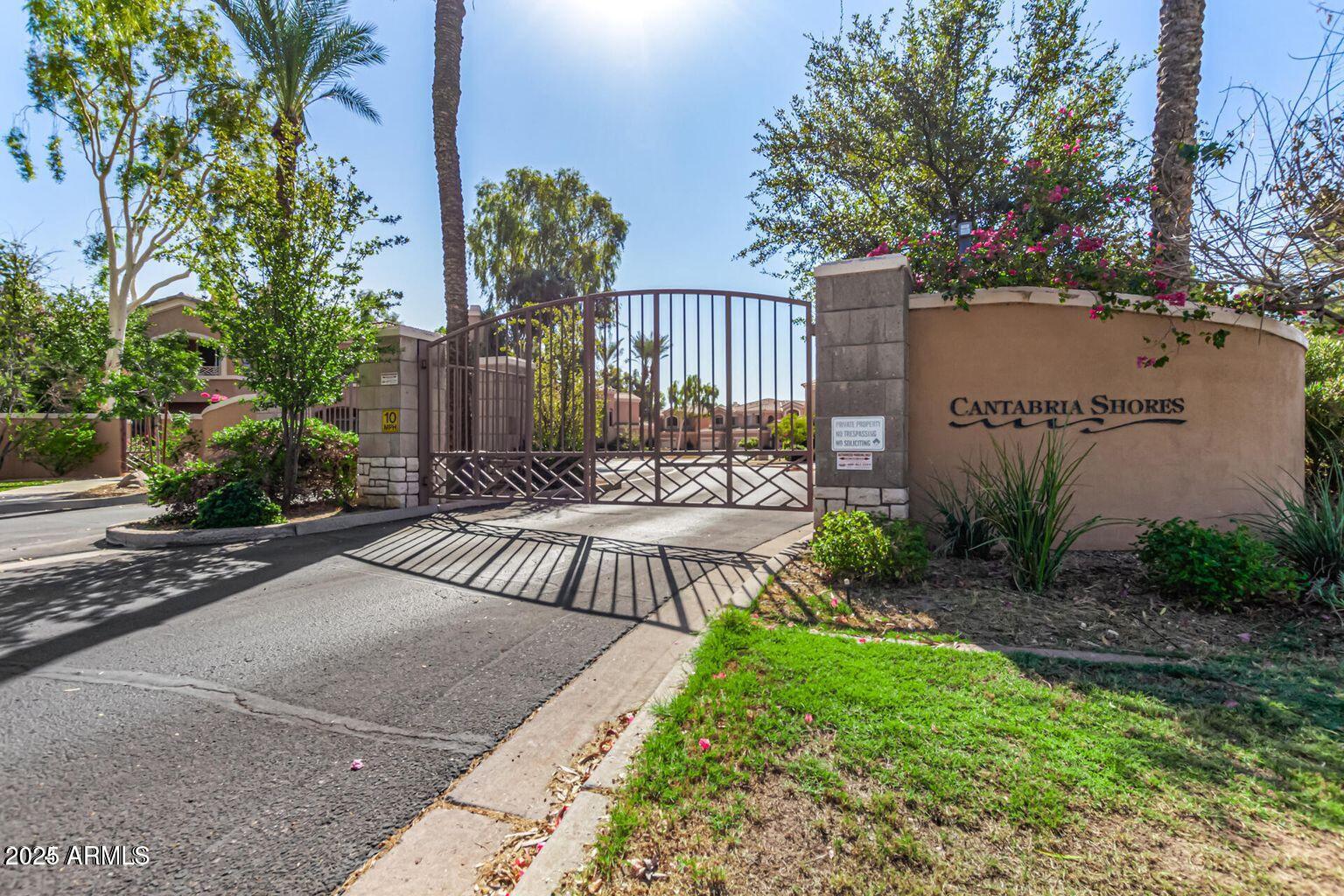 3800 South Cantabria Circle, Unit 1013 Chandler, AZ 85248 - Photo 1 of 39 a view of a patio with couches table and chairs and potted plants