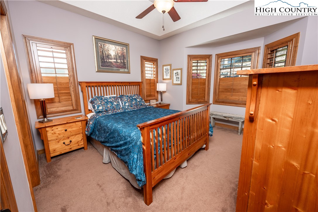 342 Ridgeline Drive, Unit 15B Sugar Mountain, NC 28604 - Photo 15 of 26 a bedroom with furniture and a window