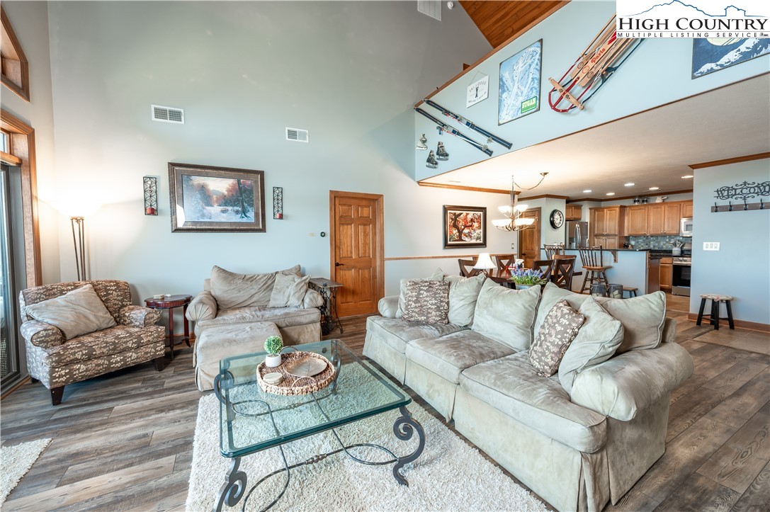 342 Ridgeline Drive, Unit 15B Sugar Mountain, NC 28604 - Photo 21 of 26 a living room with furniture and a view of kitchen