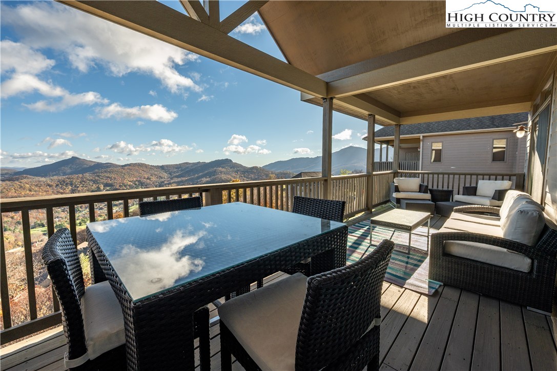342 Ridgeline Drive, Unit 15B Sugar Mountain, NC 28604 - Photo 25 of 26 a terrace of a house with outdoor seating