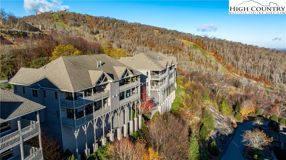 342 Ridgeline Drive, Unit 15B Sugar Mountain, NC 28604 - Photo 5 of 26 a view of a house with a mountain in the background