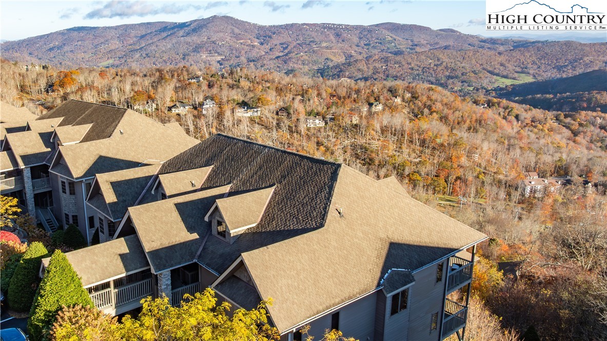 342 Ridgeline Drive, Unit 15B Sugar Mountain, NC 28604 - Photo 8 of 26 an aerial view of house yard and mountain view