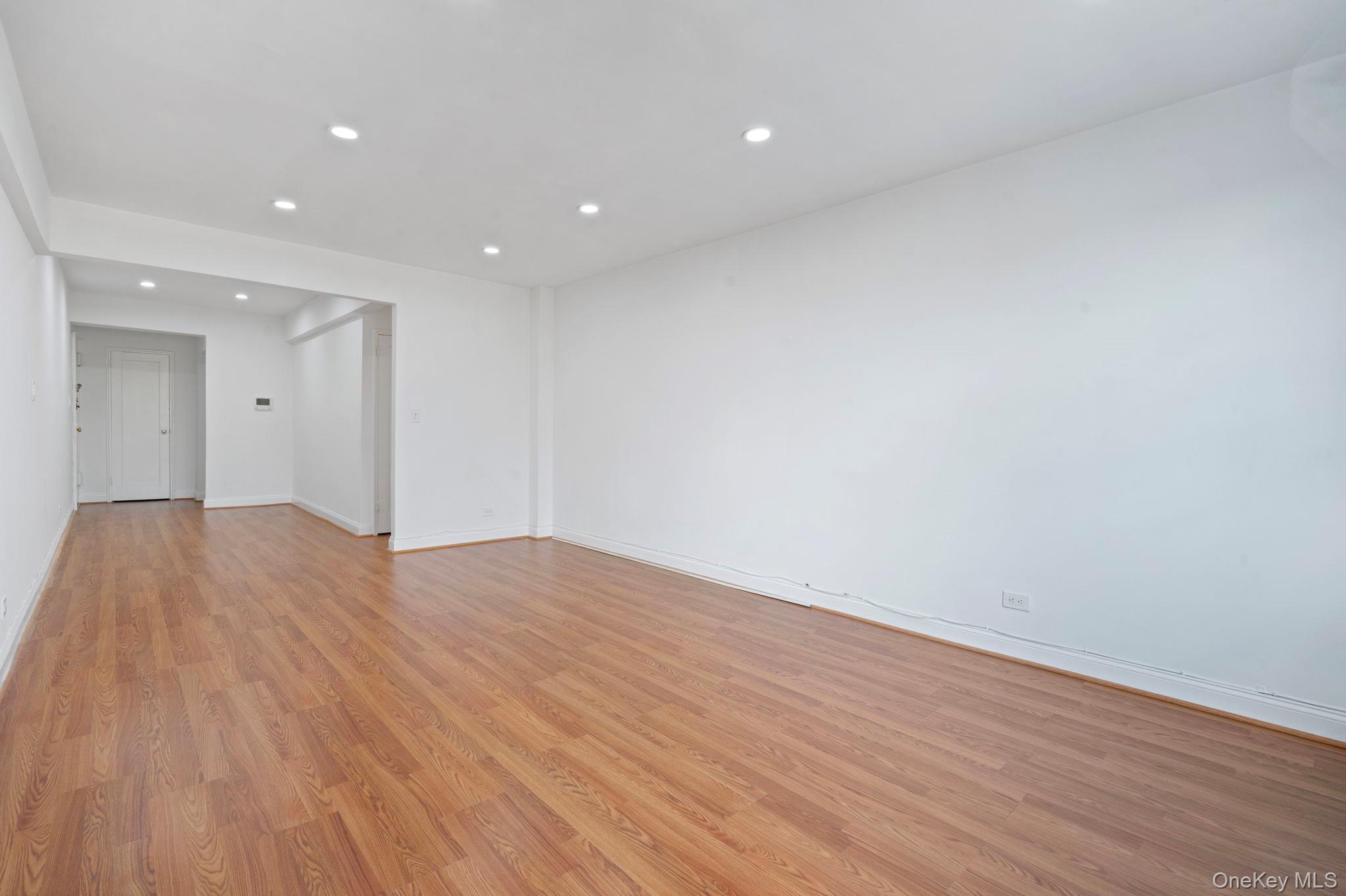 32-40 89th Street, Unit C409 Queens, NY 11369 - Photo 11 of 32 a view of empty room with wooden floor