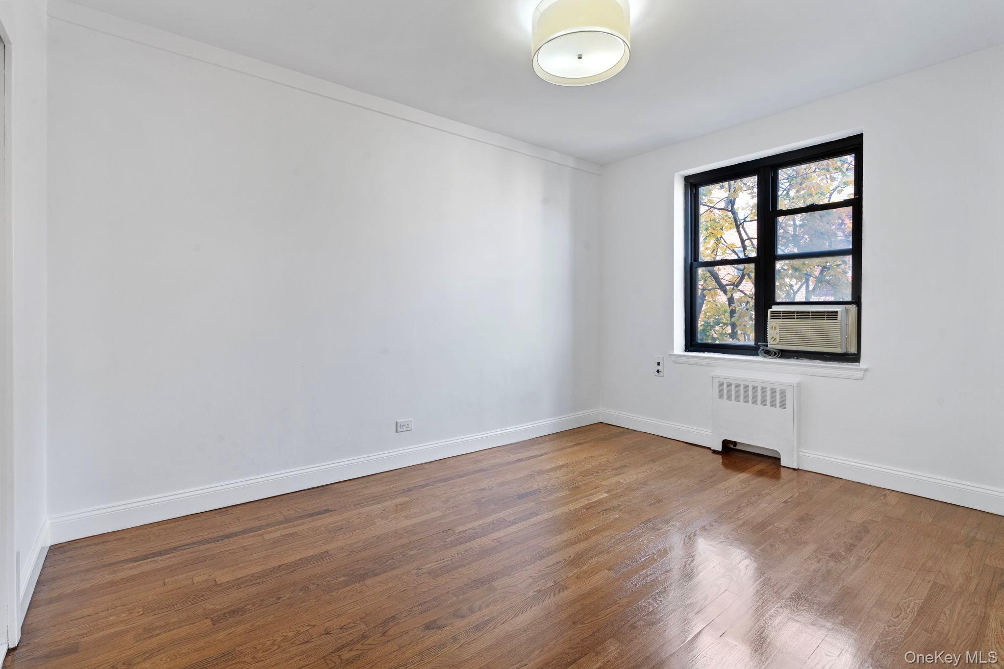 32-40 89th Street, Unit C409 Queens, NY 11369 - Photo 12 of 32 an empty room with a window