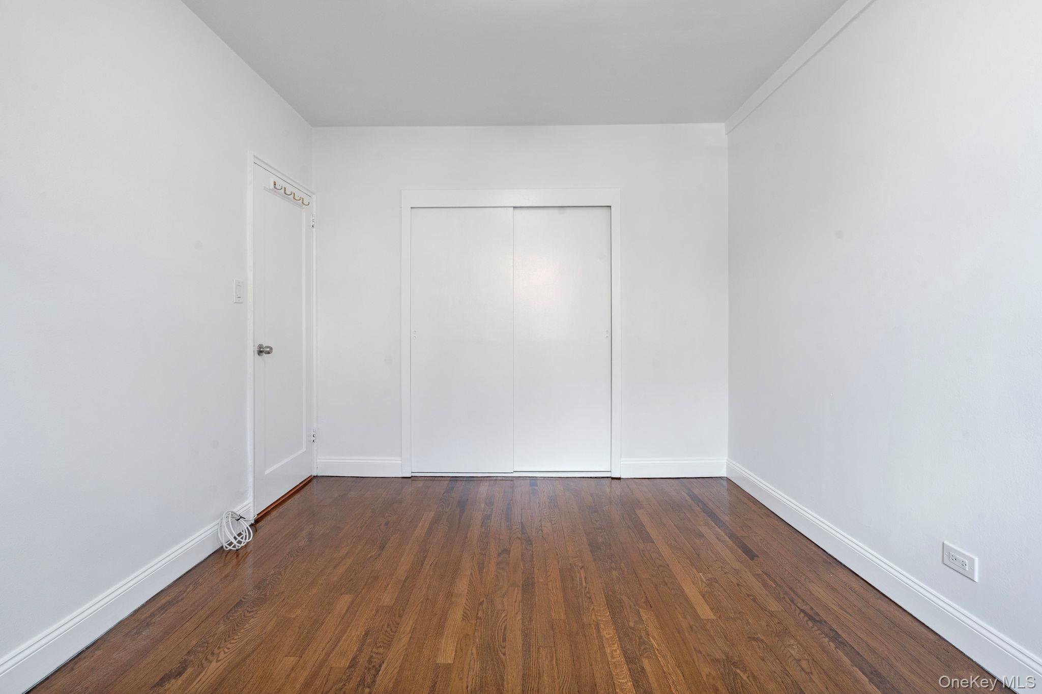 32-40 89th Street, Unit C409 Queens, NY 11369 - Photo 13 of 32 a view of wooden floor in a room