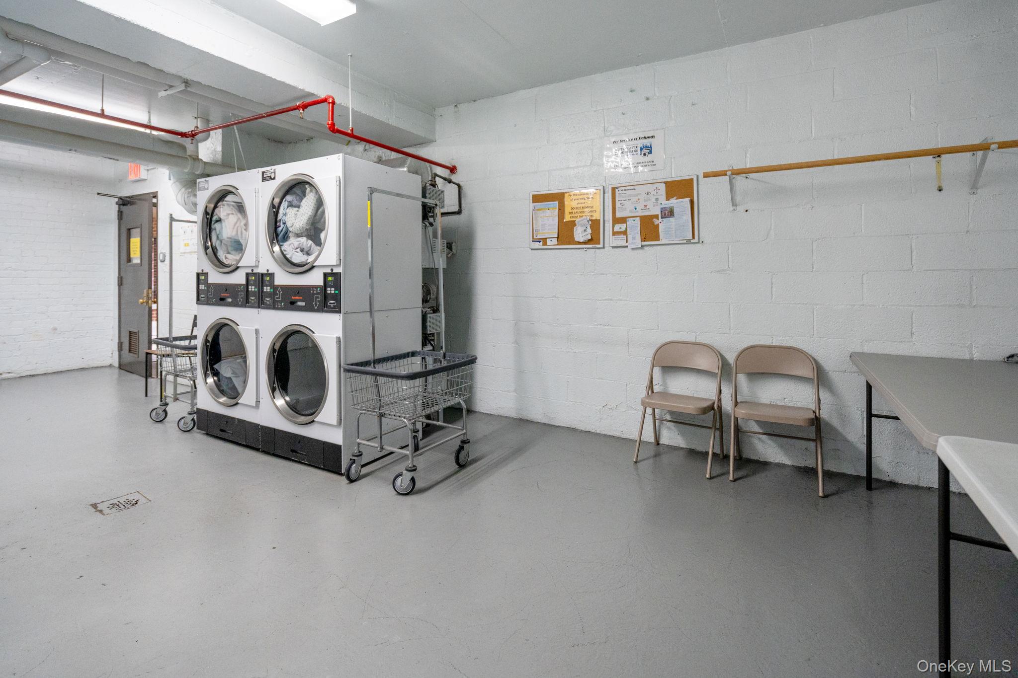 32-40 89th Street, Unit C409 Queens, NY 11369 - Photo 25 of 32 a view of a livingroom with washer and dryer