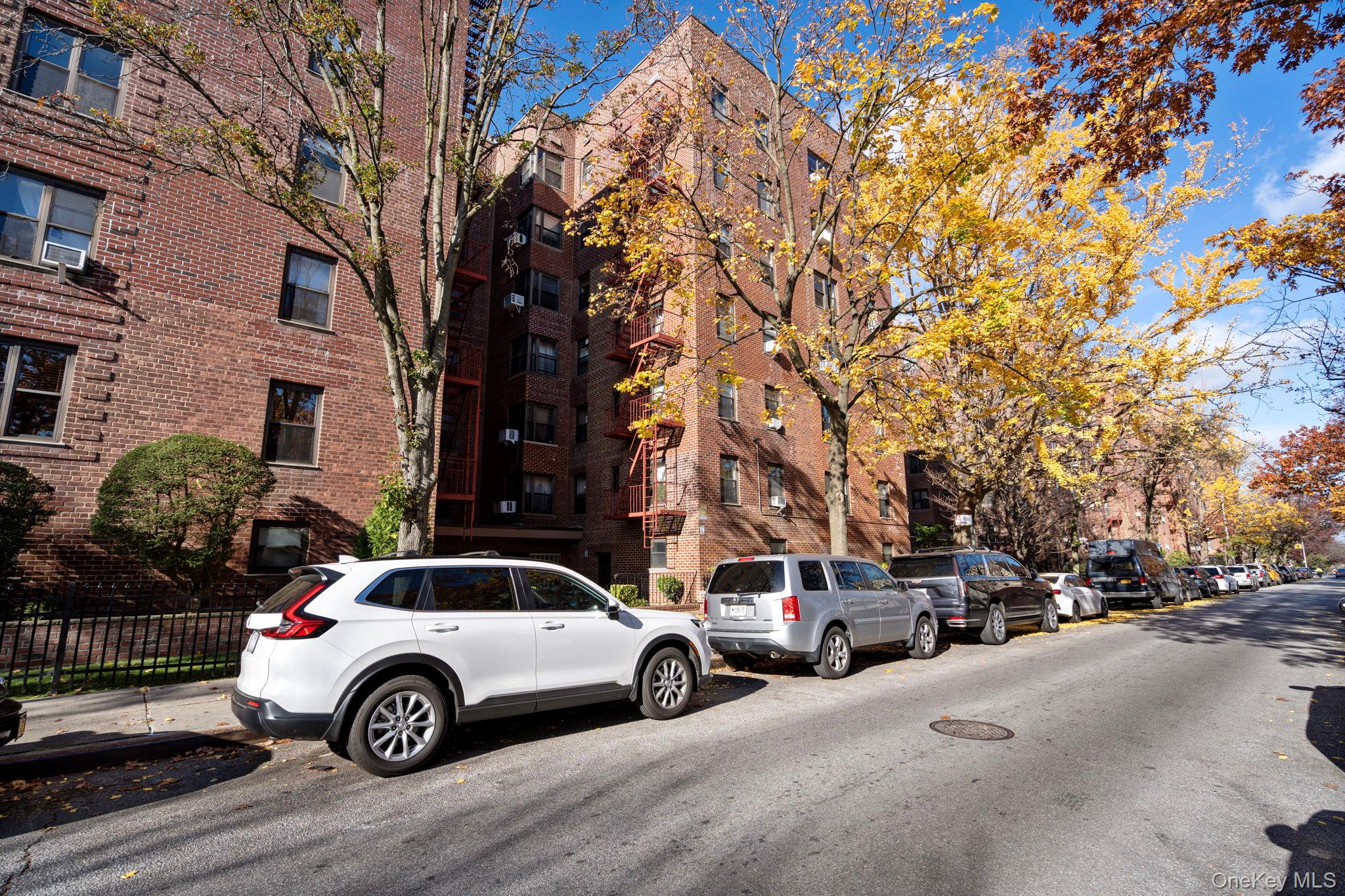 32-40 89th Street, Unit C409 Queens, NY 11369 - Photo 30 of 32 a car parked in front of a building