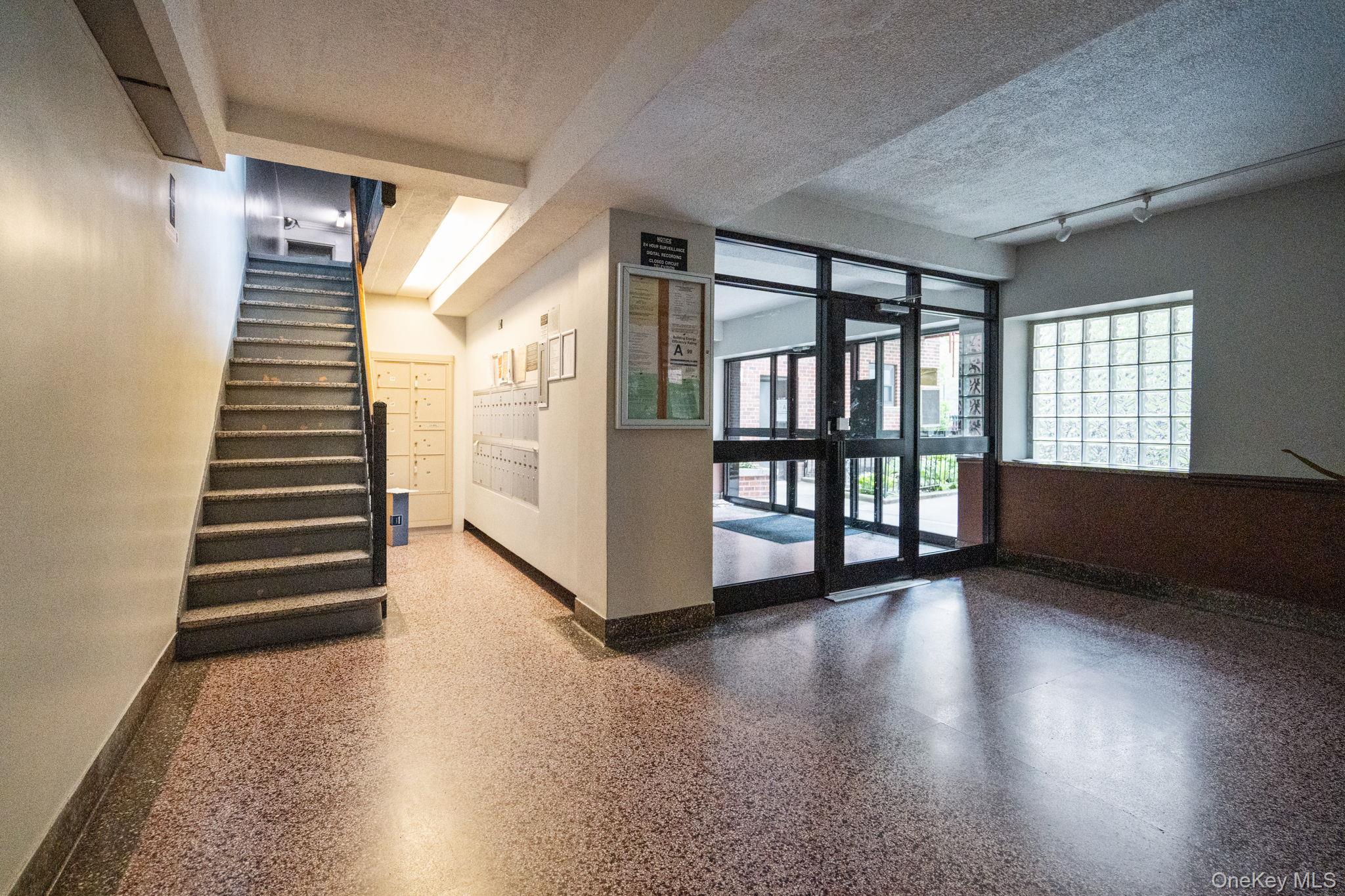32-40 89th Street, Unit C409 Queens, NY 11369 - Photo 3 of 32 a view of an entryway with wooden floor