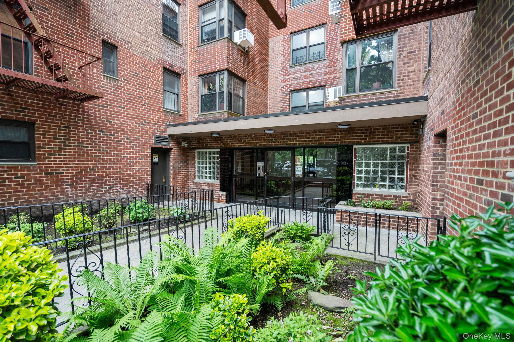 32-40 89th Street, Unit C409 Queens, NY 11369 - Photo 32 of 32 a house view with a garden space